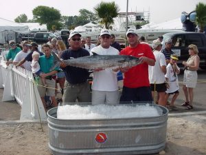 3 men holding fish